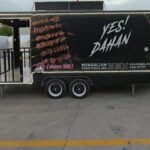 Left-side exterior of a custom BBQ food trailer with open serving window, built by Luxe Custom Co.