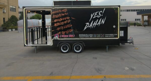 Left-side exterior of a custom BBQ food trailer with open serving window, built by Luxe Custom Co.