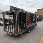 Front exterior of a BBQ mobile food trailer with branded design, crafted by Luxe Custom Co.
