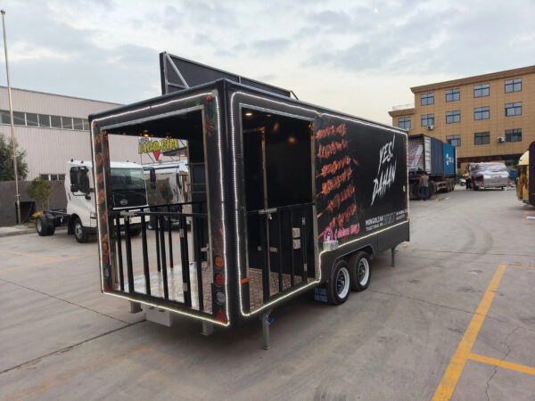 Front exterior of a BBQ mobile food trailer with branded design, crafted by Luxe Custom Co.