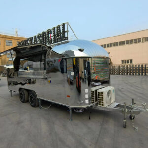 Silver round-body bar trailer with open window and AC unit, built by Luxe Custom Co.