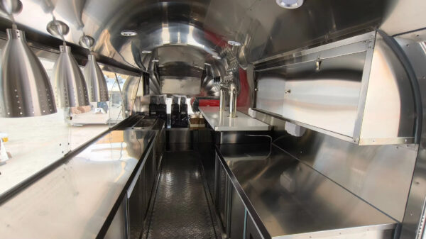 Opposite side of bar trailer interior with counter space and storage, crafted by Luxe Custom Co.