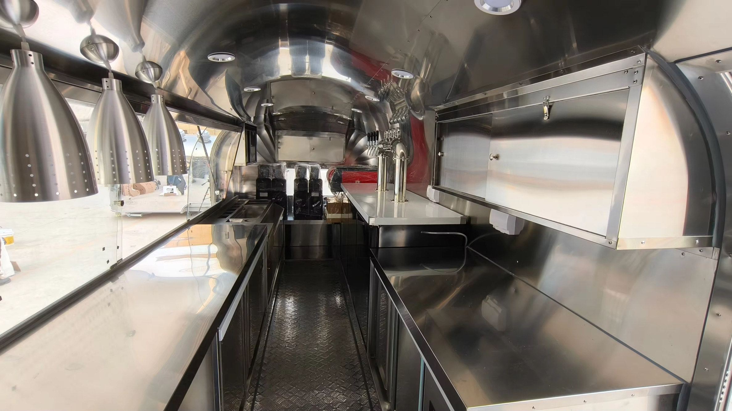 Opposite side of bar trailer interior with counter space and storage, crafted by Luxe Custom Co.