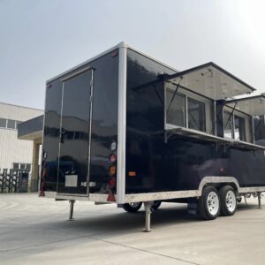Bar trailer interior with stainless steel counters, ventilation hoods, and storage, built by Luxe Custom Co.