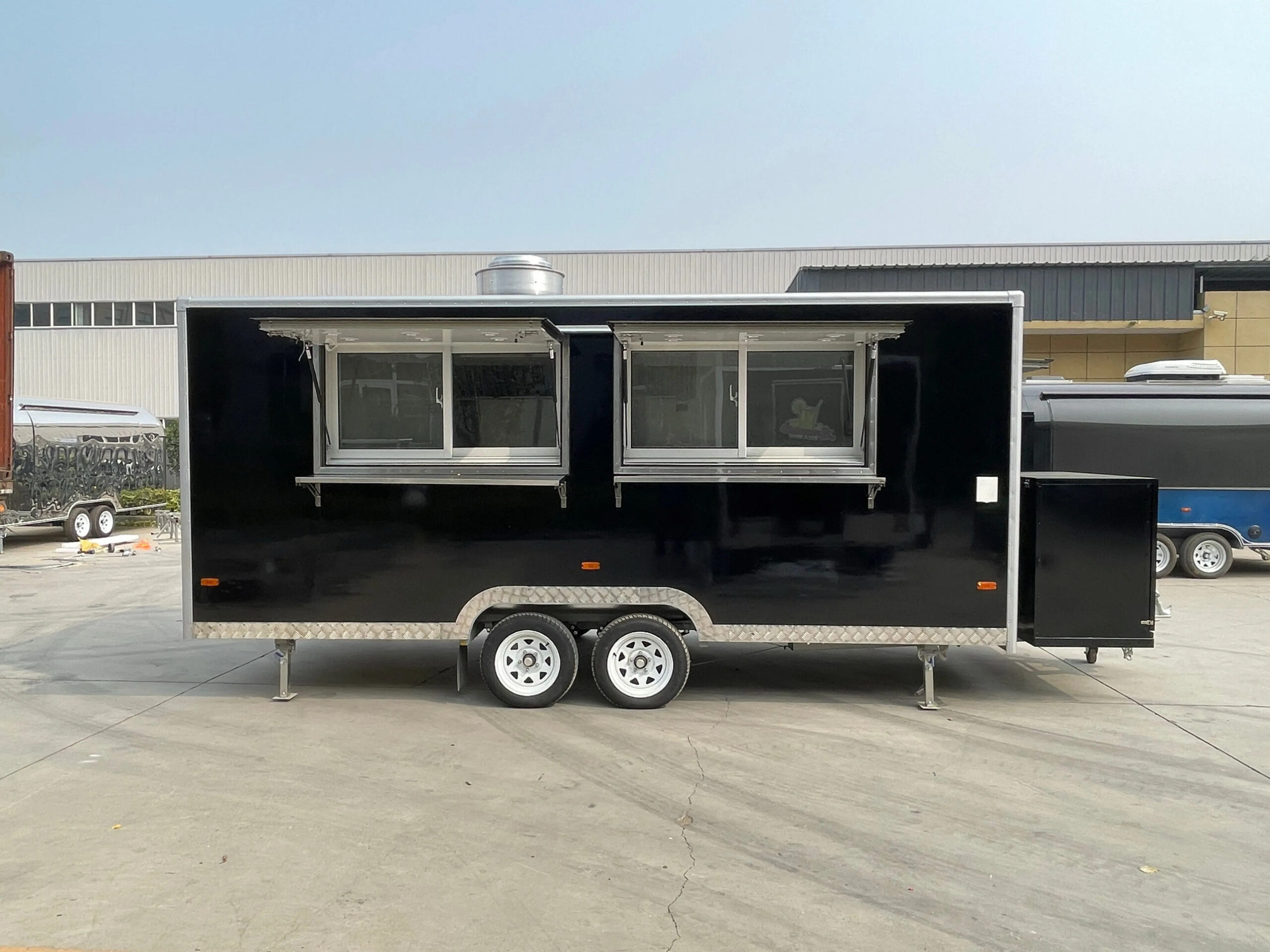 Right-side exterior of a square-body bar trailer with custom wrap, crafted by Luxe Custom Co.