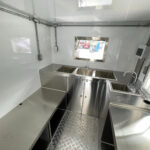 Interior of a bar trailer with a compliant hand wash sink, built by Luxe Custom Co.