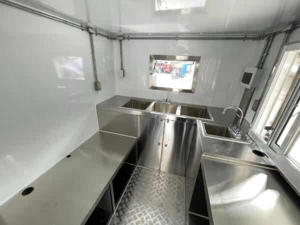 Interior of a bar trailer with a compliant hand wash sink, built by Luxe Custom Co.