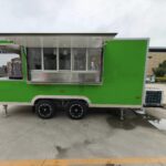 Vibrant exterior of a custom concession trailer with fruit-inspired wrap, crafted by Luxe Custom Co food trailer builders.