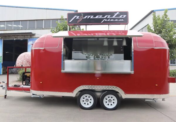 Side exterior of a 16ft pizza trailer with open serving window, crafted by Luxe Custom Co.