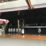 Interior of a custom concession trailer for crafted bars with stainless steel counters, built by Luxe Custom Co.