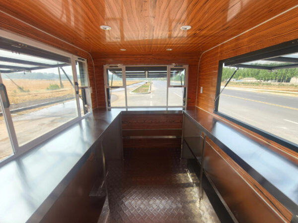 Interior of a mobile food trailer with custom bar features, built by Luxe Custom Co for buy food trailer needs.