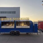 Full exterior of an 18ft custom food trailer with air conditioning, crafted by Luxe Custom Co for buy food trailer needs.