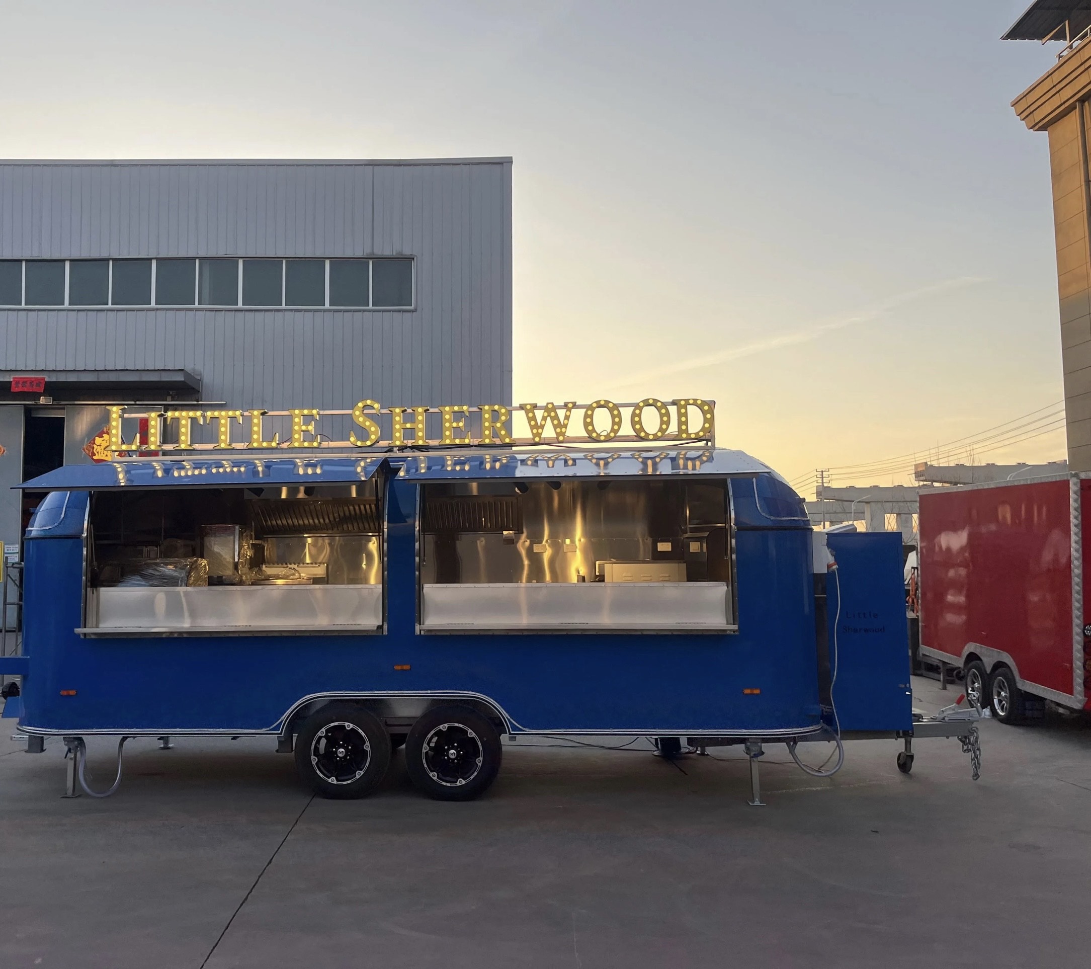 Full exterior of an 18ft custom food trailer with air conditioning, crafted by Luxe Custom Co for buy food trailer needs.