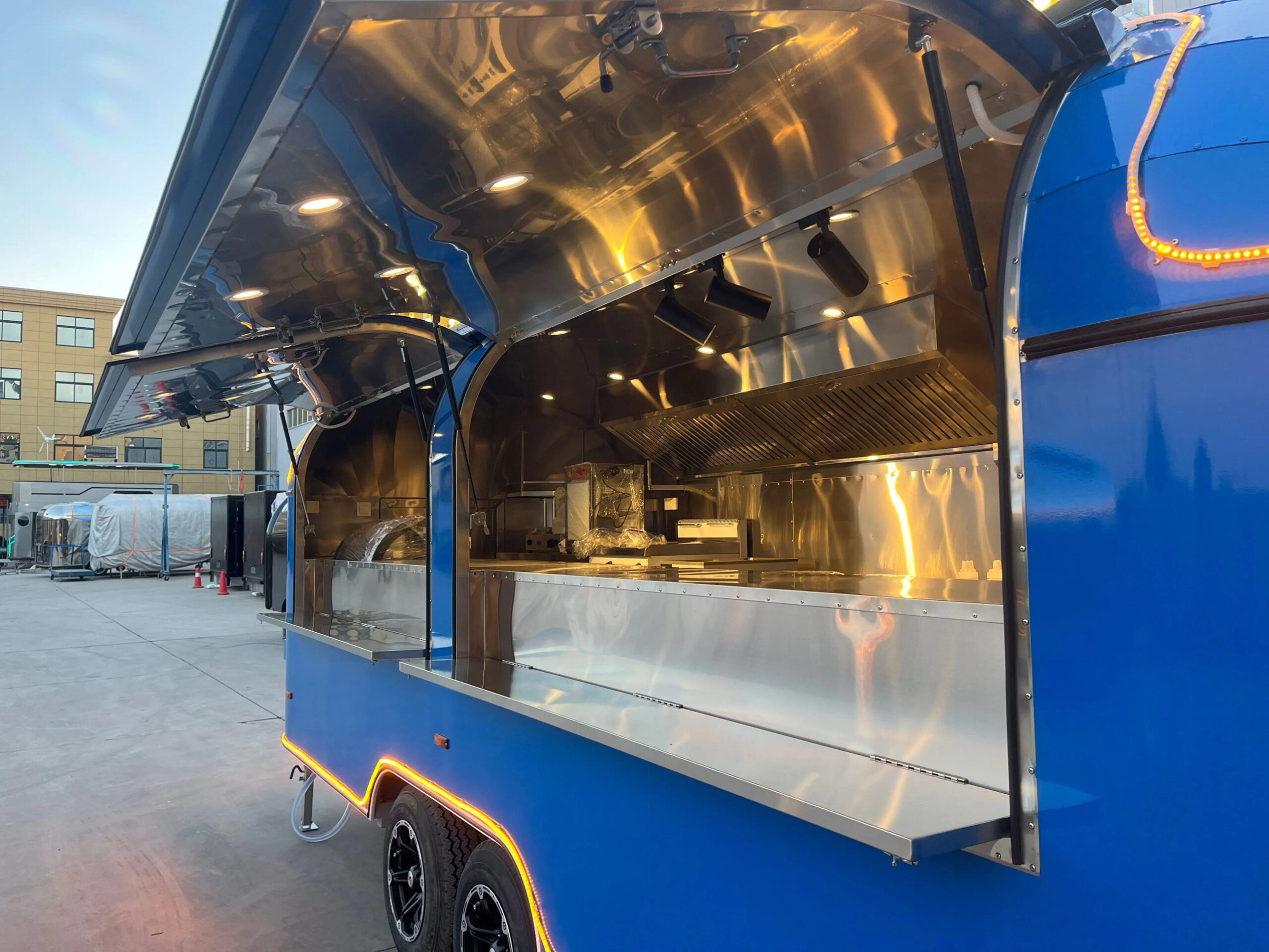 Open window exterior of an 18ft round-body food truck trailer for mobile chefs, built by Luxe Custom Co.