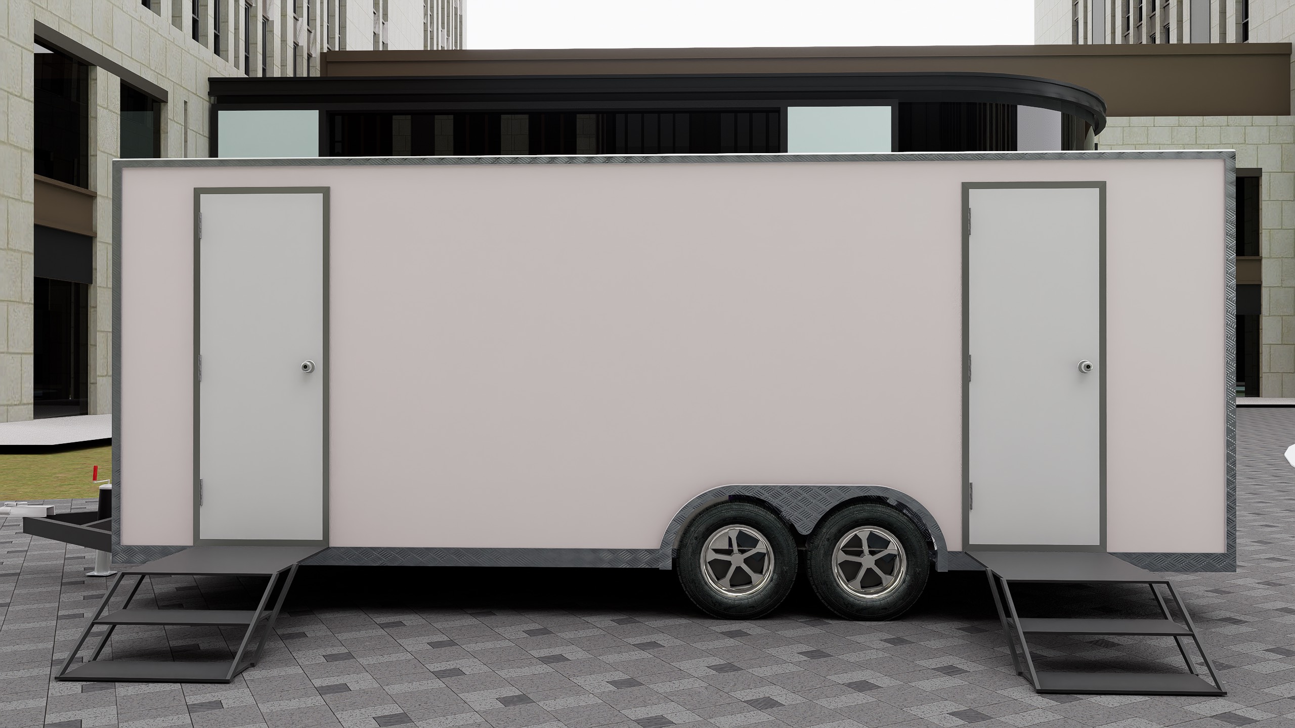 Sleek bathroom trailer exterior with vibrant wrap and sturdy frame by Luxe Custom Co, custom trailer builders.