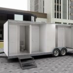 Luxurious bathroom trailer interior with premium fixtures and sleek design by Luxe Custom Co, expert custom trailer builders.
