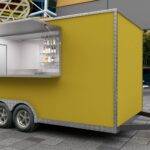 Exterior of a yellow custom food trailer with modern aesthetics, crafted by Luxe Custom Co food trailer builders.
