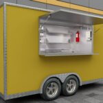 Side exterior of a yellow food truck trailer with branded wrap, built by Luxe Custom Co for food trailers for sale near me.