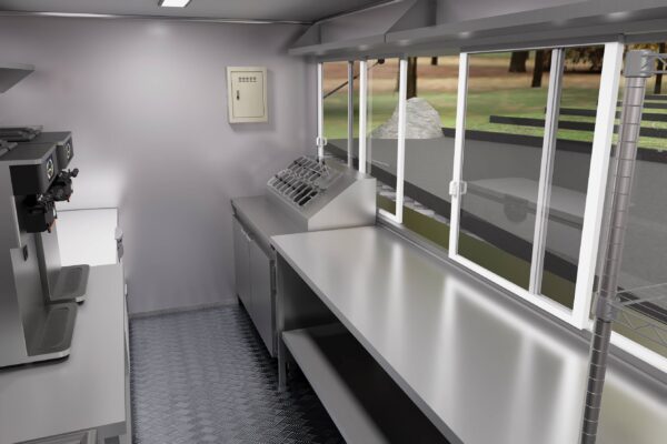 Interior of a custom food trailer with stainless steel setup and ventilation for ice cream, crafted by Luxe Custom Co.