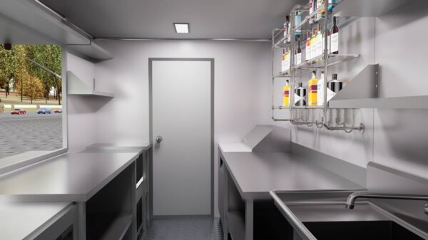 Stainless steel interior of a 13ft custom bar food truck trailer with freezer and hand sink, crafted by Luxe Custom Co food trailer builders.